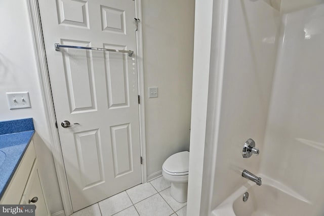 bathroom with shower / bathtub combination, toilet, tile patterned flooring, and vanity