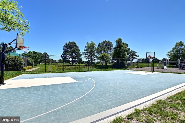 view of sport court featuring community basketball court and fence