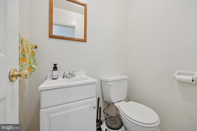 half bath with vanity and toilet