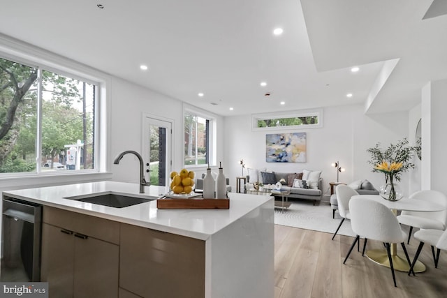 2524 41st St NW Unit 1, Washington, DC 20007 - kitchen featuring stainless steel dishwasher, light wood-style floors, open floor plan, recessed lighting, and a sink