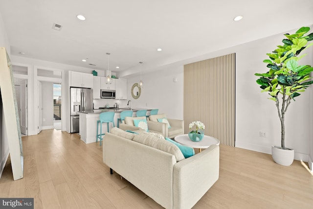 4016 Georgia Ave NW Unit 9, Washington, DC 20011 - living room with recessed lighting, baseboards, visible vents, and light wood-type flooring