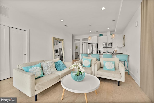 4016 Georgia Ave NW Unit 9, Washington, DC 20011 - living area featuring light wood-style floors, recessed lighting, and visible vents