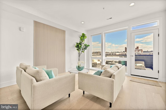 4016 Georgia Ave NW Unit 9, Washington, DC 20011 - living room featuring light wood-style floors, baseboards, recessed lighting, and visible vents