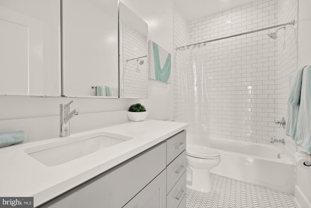 4016 Georgia Ave NW Unit 9, Washington, DC 20011 - full bath featuring vanity, shower / tub combo with curtain, tile patterned flooring, and toilet