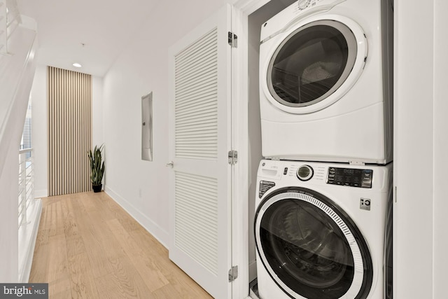 4016 Georgia Ave NW Unit 9, Washington, DC 20011 - laundry area featuring stacked washer / drying machine, laundry area, recessed lighting, baseboards, and light wood-type flooring