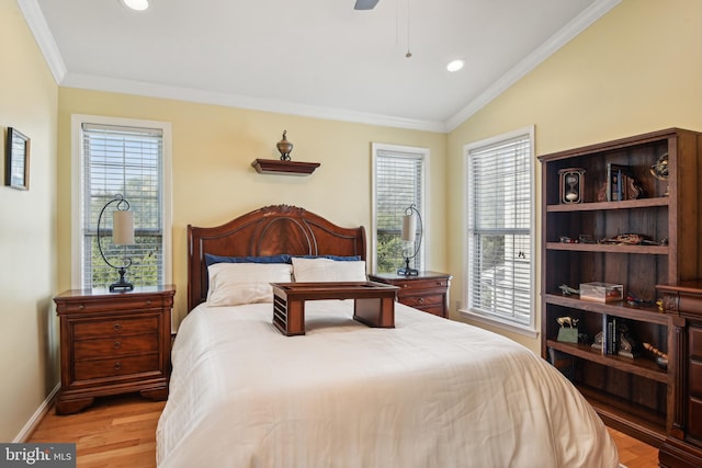 bedroom with baseboards, ornamental molding, multiple windows, and light wood-type flooring