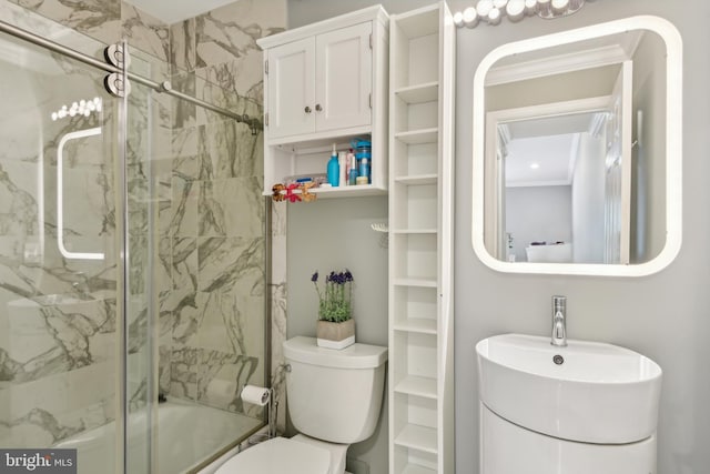bathroom featuring toilet and ornamental molding