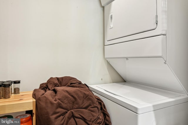washroom with laundry area and stacked washer and dryer