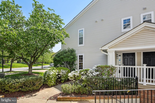 view of side of home with a porch