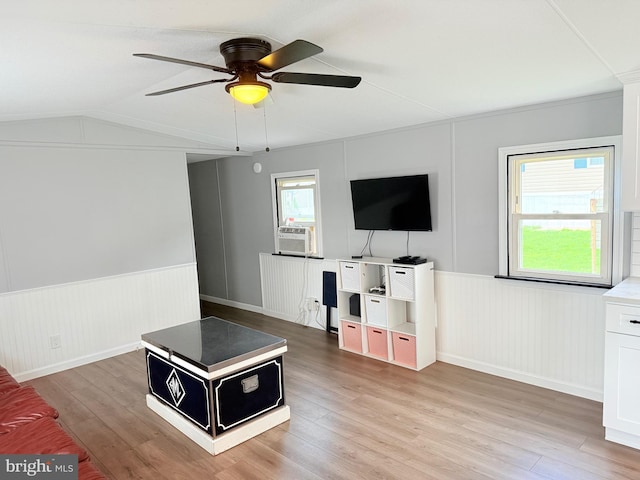 38 Clara St, Norristown, PA 19403 - living area with ceiling fan, cooling unit, wainscoting, light wood-type flooring, and vaulted ceiling