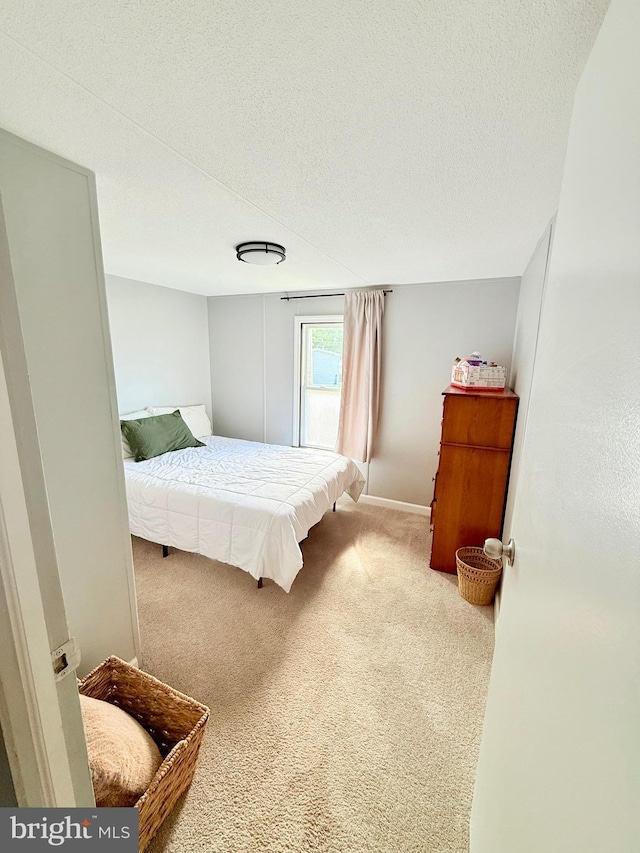 38 Clara St, Norristown, PA 19403 - carpeted bedroom featuring a textured ceiling and baseboards
