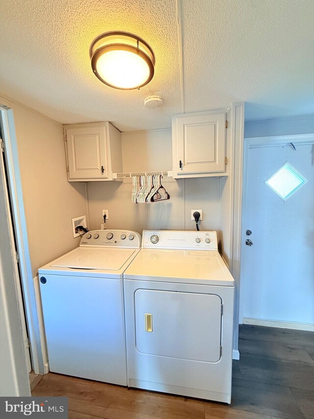 38 Clara St, Norristown, PA 19403 - laundry room with cabinet space, washing machine and clothes dryer, wood finished floors, and a textured ceiling