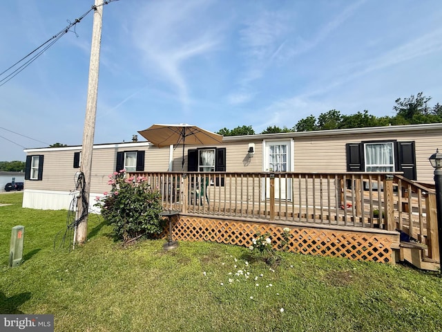 38 Clara St, Norristown, PA 19403 - rear view of house featuring a yard and a wooden deck