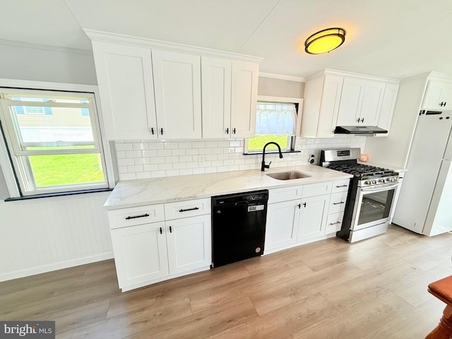 38 Clara St, Norristown, PA 19403 - kitchen featuring dishwasher, freestanding refrigerator, stainless steel gas range, under cabinet range hood, and crown molding