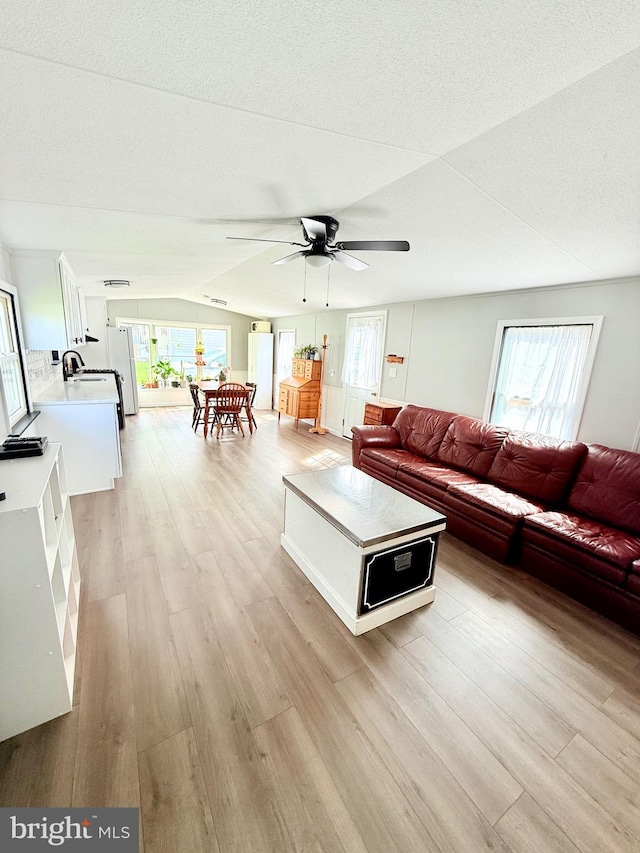 38 Clara St, Norristown, PA 19403 - living area featuring light wood-type flooring, ceiling fan, and plenty of natural light