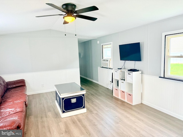 38 Clara St, Norristown, PA 19403 - unfurnished living room featuring light wood-style floors, a ceiling fan, vaulted ceiling, and wainscoting