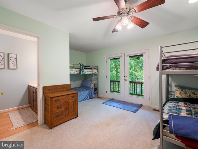 173 Riverside Dr, Harpers Ferry, WV 25425 - bedroom with french doors, access to exterior, baseboards, and light carpet