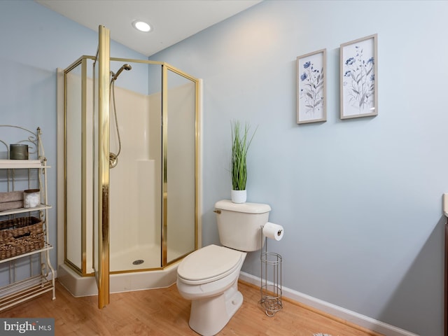 173 Riverside Dr, Harpers Ferry, WV 25425 - bathroom with wood finished floors, a stall shower, toilet, and baseboards