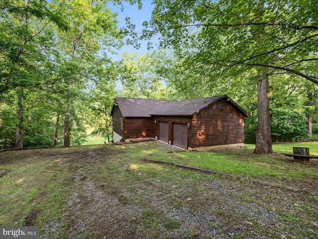 173 Riverside Dr, Harpers Ferry, WV 25425 - view of yard with a garage