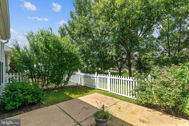 view of patio featuring fence