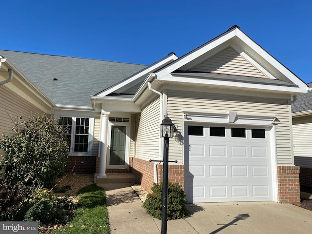 view of front of property with brick siding and driveway