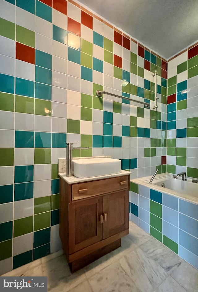 2102 E Dauphin St, Philadelphia, PA 19125 - full bath with tile walls, tiled tub, and vanity