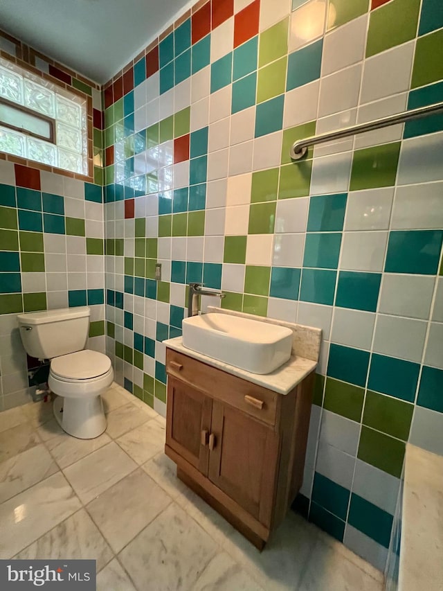 2102 E Dauphin St, Philadelphia, PA 19125 - half bath featuring tile walls, toilet, and vanity
