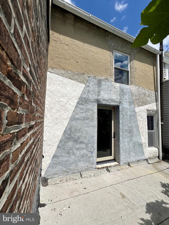 2102 E Dauphin St, Philadelphia, PA 19125 - rear view of property with stucco siding