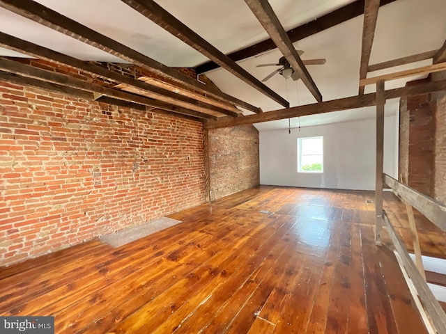 2102 E Dauphin St, Philadelphia, PA 19125 - unfurnished living room featuring brick wall, a ceiling fan, beam ceiling, and hardwood / wood-style flooring