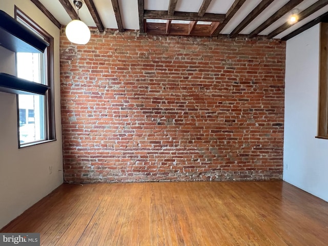 2102 E Dauphin St, Philadelphia, PA 19125 - unfurnished room featuring wood-type flooring, beam ceiling, brick wall, and healthy amount of natural light