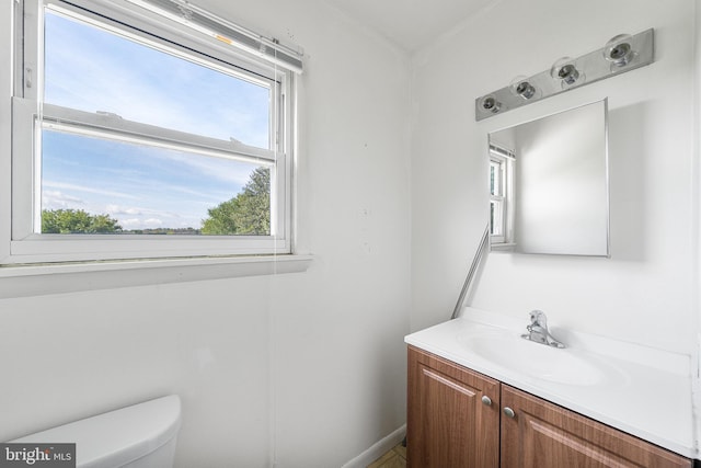 bathroom with vanity and toilet
