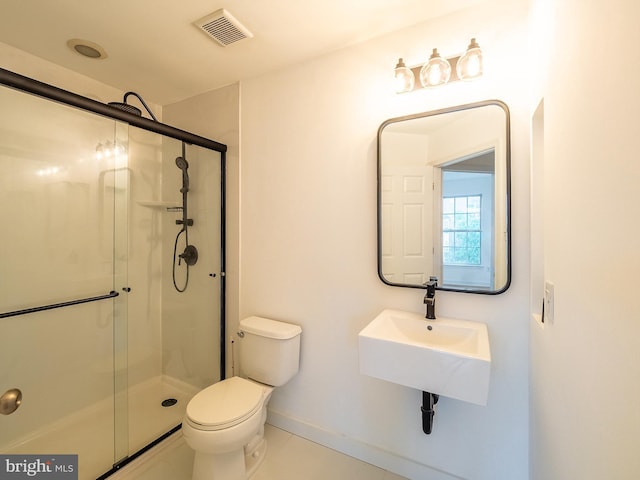 70 River Ln, Delanco, NJ 08075 - bathroom featuring toilet, a shower stall, a sink, and tile patterned flooring
