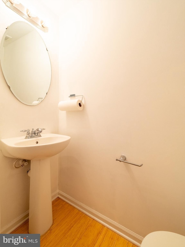 70 River Ln, Delanco, NJ 08075 - bathroom featuring wood finished floors, baseboards, a sink, and toilet