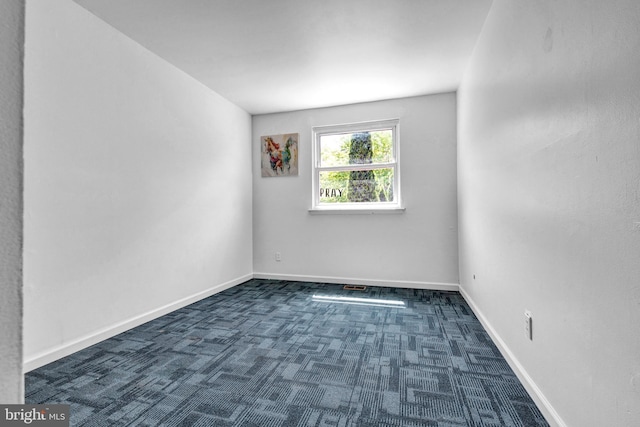 1806 Crest Dr, Coatesville, PA 19320 - spare room featuring baseboards and dark carpet