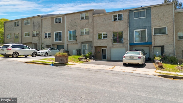 1806 Crest Dr, Coatesville, PA 19320 - view of property featuring an attached garage and driveway