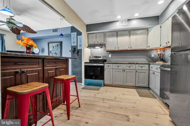 1806 Crest Dr, Coatesville, PA 19320 - kitchen featuring freestanding refrigerator, electric range, light wood-style floors, recessed lighting, and under cabinet range hood