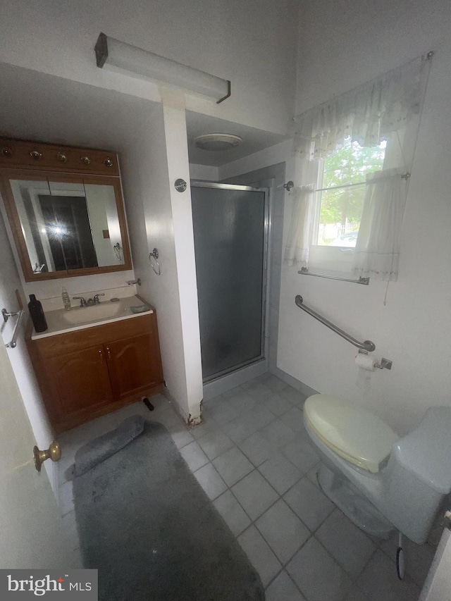 904 S Chester Rd, West Chester, PA 19382 - full bathroom with a shower stall, vanity, toilet, tile patterned floors, and baseboards