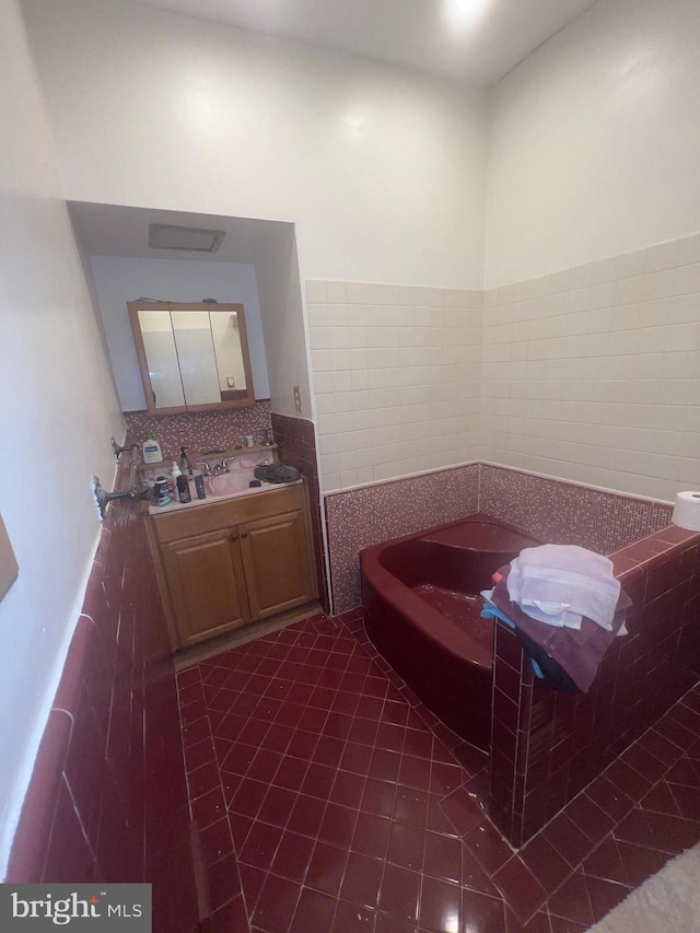 904 S Chester Rd, West Chester, PA 19382 - bathroom with a garden tub, vanity, tile patterned flooring, and backsplash