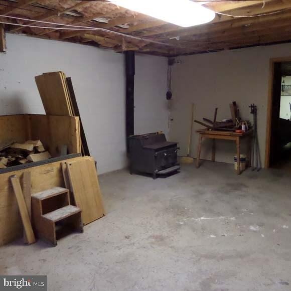 289 Cornfield Cir, Lewistown, PA 17044 - unfinished basement with a wood stove