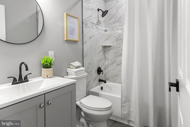 bathroom featuring toilet, shower / bath combo with shower curtain, and vanity