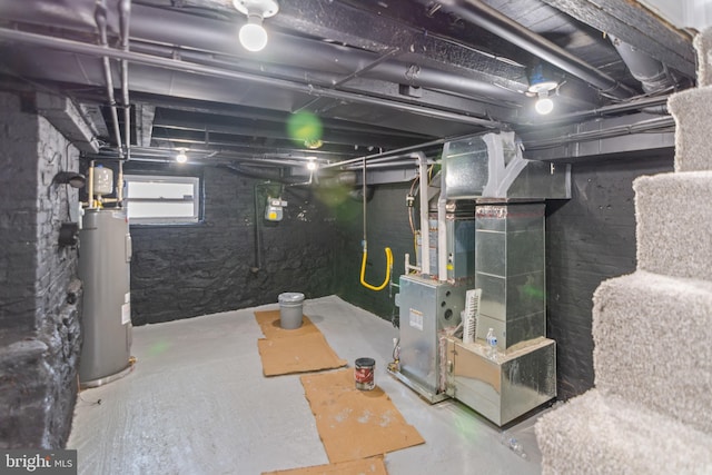 basement featuring heating unit and water heater