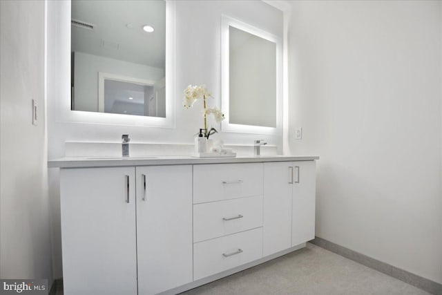 923 V St NW Unit 601, Washington, DC 20001 - bathroom with double vanity and baseboards