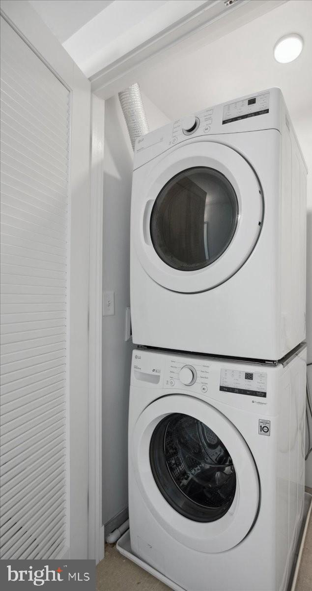 923 V St NW Unit 601, Washington, DC 20001 - laundry area featuring stacked washing machine and dryer
