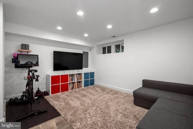 living area with recessed lighting and baseboards