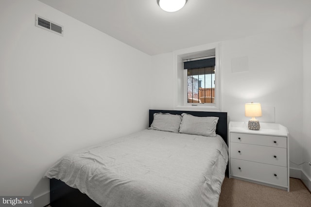 bedroom with carpet floors and baseboards