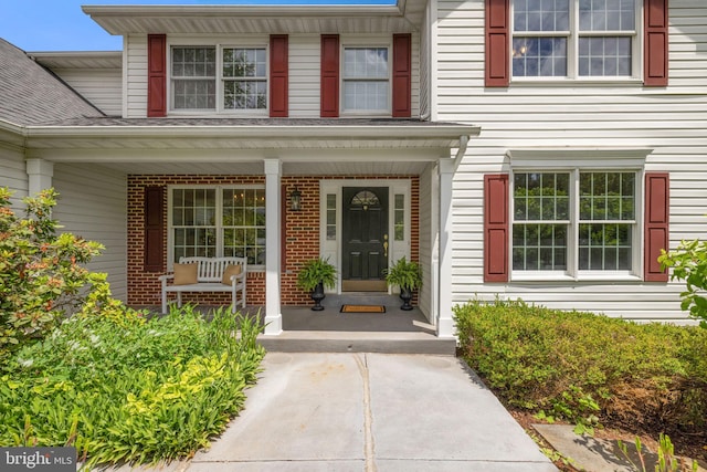 5722 Pond View Ln, Broad Run, VA 20137 - doorway to property featuring a porch and brick siding