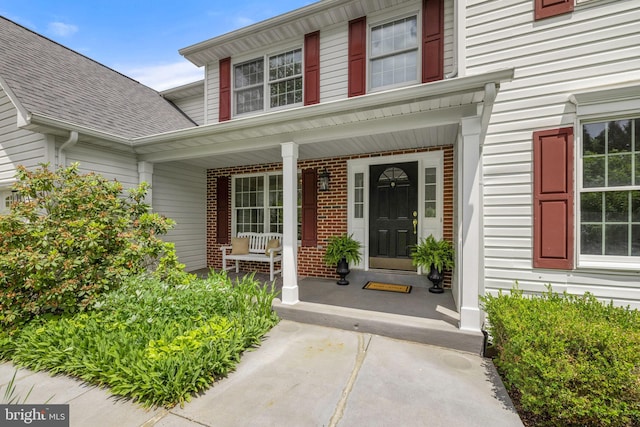 5722 Pond View Ln, Broad Run, VA 20137 - entrance to property with a porch, brick siding, and a shingled roof