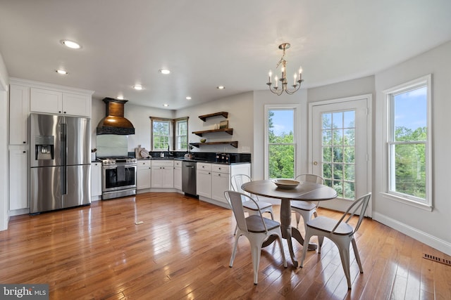 5722 Pond View Ln, Broad Run, VA 20137 - dining area with a chandelier, recessed lighting, light wood-style flooring, and baseboards
