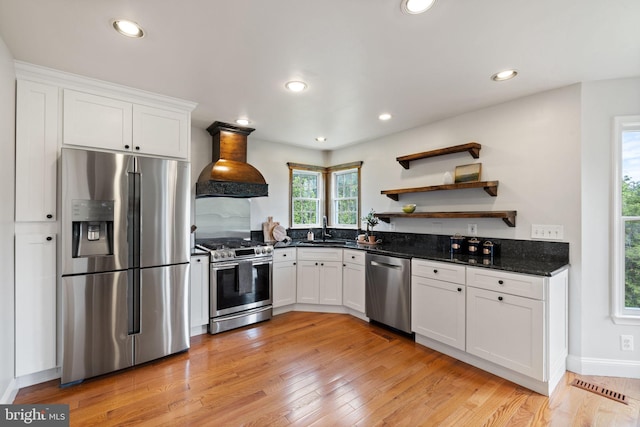 5722 Pond View Ln, Broad Run, VA 20137 - kitchen featuring appliances with stainless steel finishes, custom exhaust hood, a sink, white cabinets, and light wood finished floors
