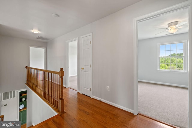 5722 Pond View Ln, Broad Run, VA 20137 - hall featuring an upstairs landing, baseboards, and wood finished floors